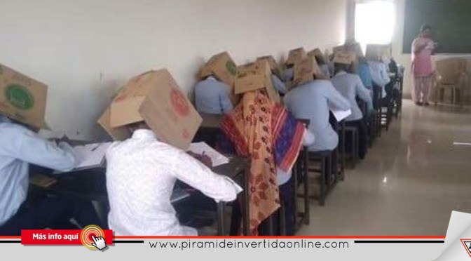 Colocan cajas en la cabeza de alumnos para evitar que copiaran en examen